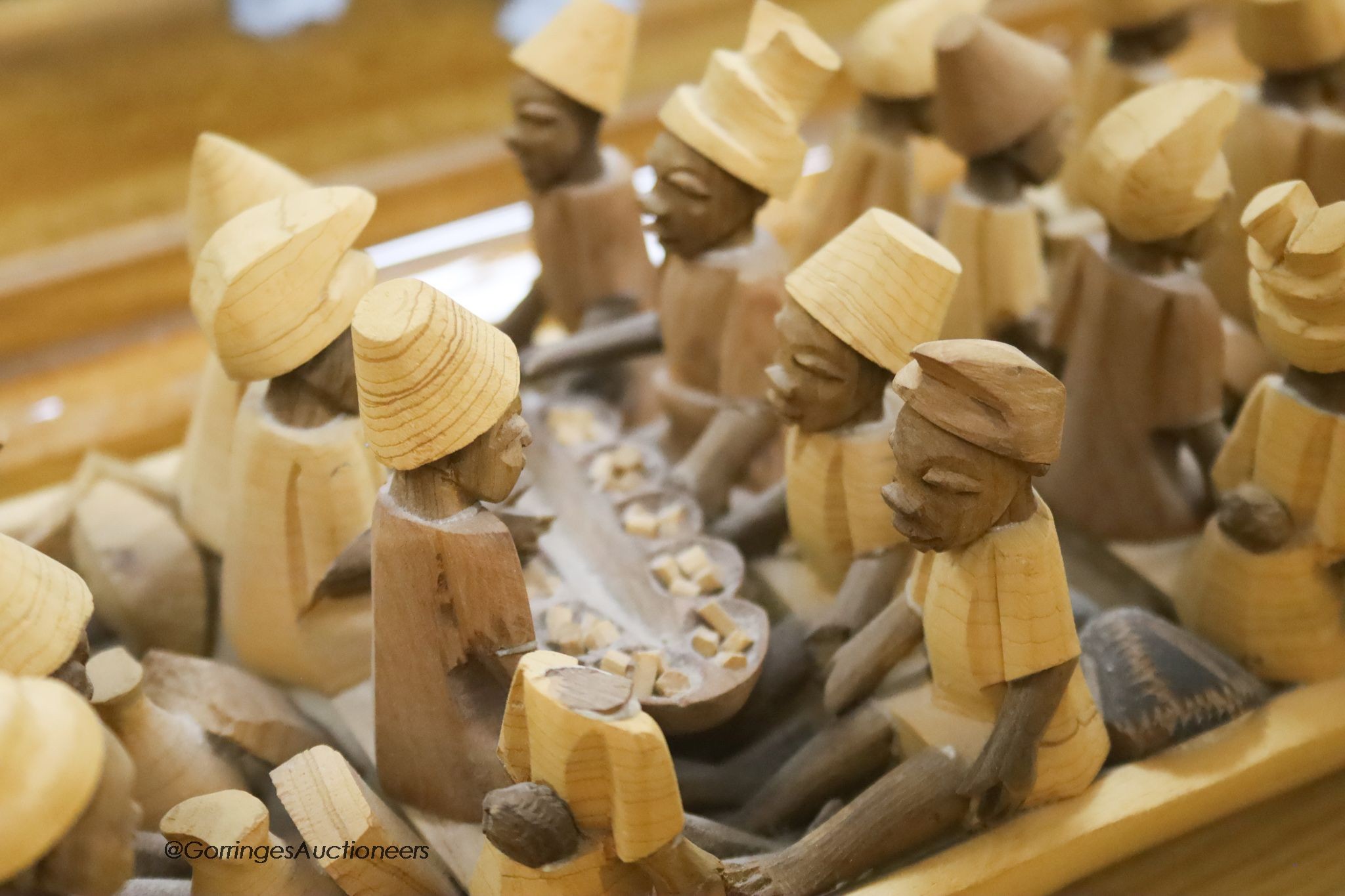 An African wood model of figures in a boat, length 155cm